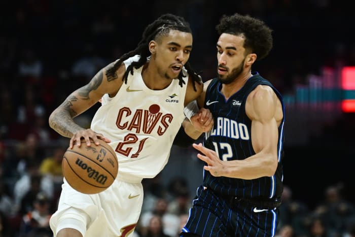 Oct 12, 2023; Cleveland, Ohio, USA; Cleveland Cavaliers forward Emoni Bates (21) drives to the basket against Orlando Magic guard Trevelin Queen (12) during the second half at Rocket Mortgage FieldHouse.